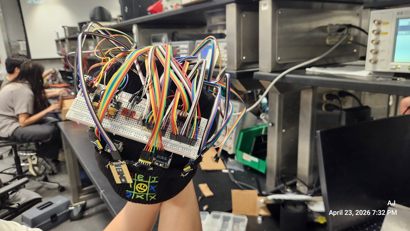 Front view of the OmniSense-Dual head module showing its breadboard, sensors, and directional wiring.